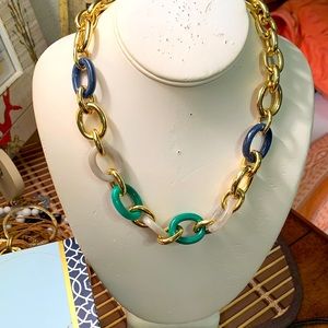 Ann Taylor’s iconic golden and blues lucite chain